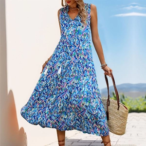 Detail of bohemian V-neck floral maxi dress with white tassels and layered cake skirt style