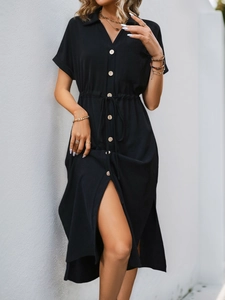 Detail of black V-neck shirt dress featuring button-down front and drawstring waist