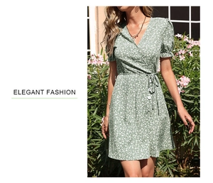 Close-up of green floral dress featuring V-neck wrap style and delicate white buttons