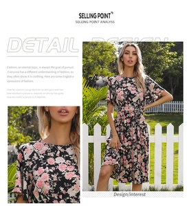 Close-up of pink rose floral pattern on black summer dress with ruffled sleeves