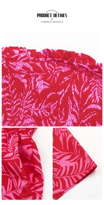 Detail of red and pink palm leaf print with smocking and ruffle trim for beach romper