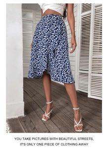 Detailed view of blue floral skirt featuring high waist ruffles and chiffon texture