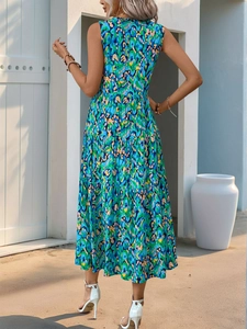 Detail of bohemian sleeveless maxi dress with blue-green abstract print and tiered skirt