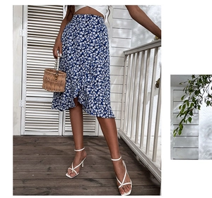 Detailed view of the blue and white floral midi skirt with irregular ruffled hemline