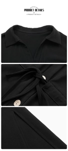 Detail of black shirt dress featuring lapel collar, waist tie, and textured round buttons