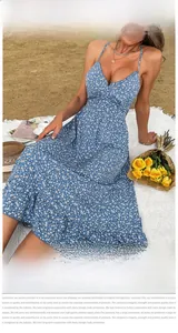 Close-up of blue floral sundress featuring daisy print and lightweight chiffon fabric