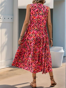 Detail of layered cake hem on bohemian sleeveless dress with pink floral leopard print
