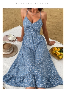 Blue floral sundress with thin straps and ruffled hem shown in a beach picnic setting