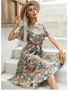 Detail of green floral midi dress with ruffle sleeves and adjustable waist tie