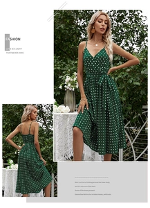 Detail of green polka dot midi dress with V-neck straps and adjustable waist tie belt