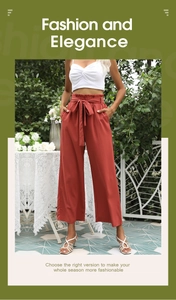 Détail de la taille haute paper-bag sur un pantalon large rouge brique avec ceinture