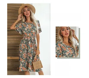 Detail view of floral pleated dress with ruffle sleeves and matching waist tie belt