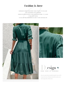 Detailed macro view of dark green high-quality silk fabric and ruffled sleeve texture