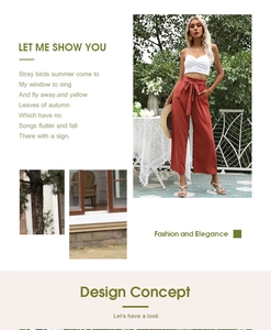 Détail du pantalon large à taille haute avec un nœud décoratif élégant en rouge brique