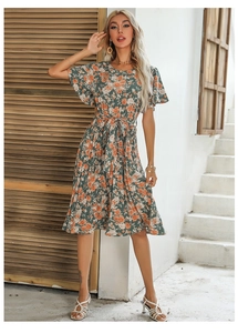 Detailed view of floral ruffle sleeves and waist drawstring on a chiffon summer dress