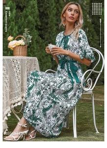 Detail of bohemian floral maxi dress featuring tiered ruffle sleeves and drawstring V-neckline