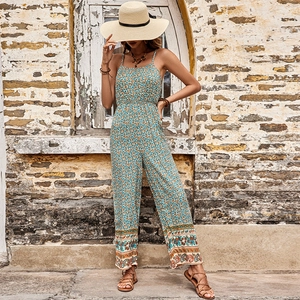 Summer floral print sleeveless jumpsuit with ethnic lace trim and straw hat accessory