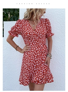 Close-up of red floral V-neck dress with ruffle details and summer chiffon texture