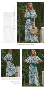 Detail of V-neck maxi dress featuring tropical leaf prints and elegant ruffle sleeves