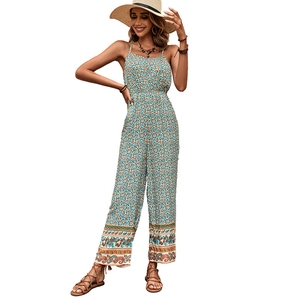 Bohemian floral wide-leg jumpsuit with straps and ethnic print on white background