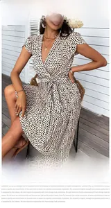 Detailed view of the leopard print pattern and ruffled butterfly sleeves on the dress