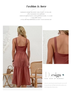 Detail of brick red cotton linen backless dress with tiered ruffles and wide straps