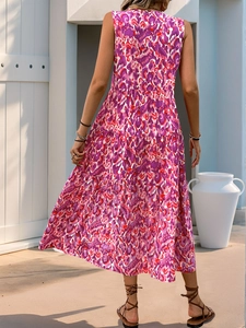 Detail view of the back of a sleeveless tiered maxi dress with bohemian purple floral prints