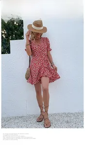 Detail of red floral wrap dress with ruffle sleeves and airy French summer patterns
