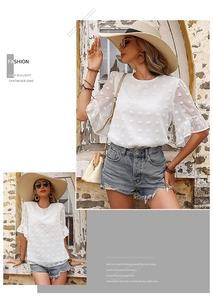 Detail of white Swiss Dot chiffon fabric and ruffle sleeves on women summer blouse