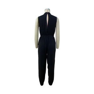Back view of a black sleeveless jumpsuit with central zipper and elastic waist detail