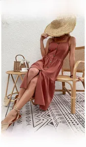 Detail of terracotta cotton linen backless dress with buttons and vintage flared skirt