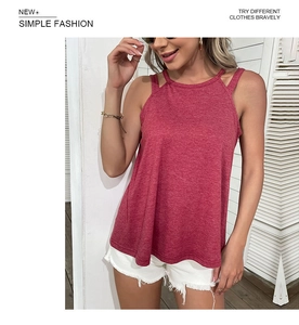 Close-up of cutout shoulder detail on a burgundy sleeveless top with textured fabric