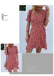 Detail shot of the red floral wrap dress featuring ruffle sleeves and waist tie design