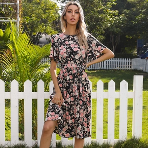 Floral pleated midi dress with ruffle sleeves and waist tie on a black background