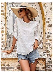 Detailed texture of white Swiss dot chiffon fabric on ruffle sleeve summer blouse