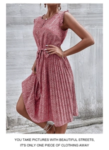 Detail of red floral sleeveless pleated dress with a matching waist tie belt