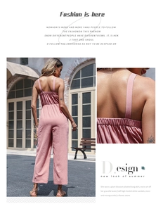 Detail view of the elastic waist and wide strap structure on pink linen wide-leg jumpsuit