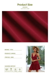 Close-up detail of burgundy backless dress fabric texture with wash care instructions