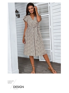 Detail of V-neck wrap dress with leopard print and ruffled sleeves for summer beach wear