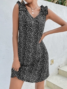 Detail of V-neck leopard print summer dress with ruffled shoulders and lightweight fabric