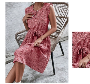 Detail of red ditsy floral dress showing the waist drawstring and sleeveless neckline