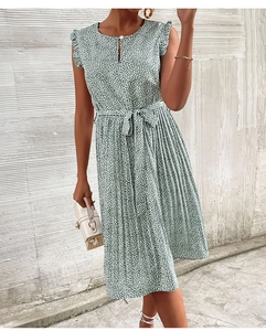 Detail of green floral sleeveless dress showing pleated skirt and waist tie detail
