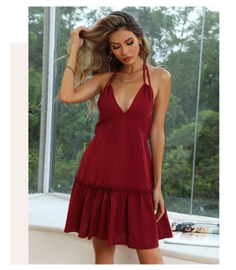 Detail of dark red backless mini dress with deep V-neckline and ruffled hemline