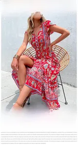 Close-up of V-neck bohemian floral dress with ruffle sleeves and vintage ethnic patterns