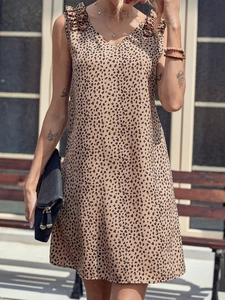 Detail of V-neck leopard print sleeveless dress with ruffle shoulder and flowy fabric