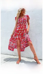 Detail of red floral V-neck dress featuring bohemian prints and ruffled sleeves