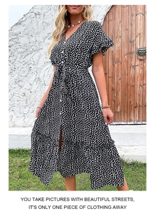Detail of V-neck floral summer dress featuring short ruffle sleeves and waist tie belt