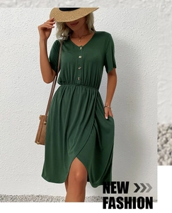 Detail of dark green short sleeve dress with V-neck and asymmetrical hem for summer