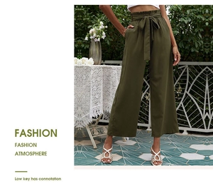 Détail du pantalon large taille haute vert olive avec ceinture à nouer et taille froncée