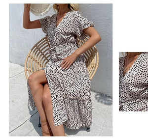 Detail view showing V-neck buttons and leopard print texture on a summer wrap dress